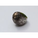 A small Edwardian novelty silver pin cushion modelled as a bird with green velvet cushion by Sampson