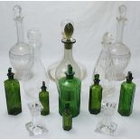 A pair of Villeroy & Boch glass candlesticks, six various decanters and six dark green chemist/