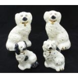 A pair of Beswick Staffordshire spaniels, approximately 20cm high, together with two other Beswick