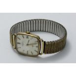 A gents 9ct gold cased Rotary wristwatch, the rectangular silvered dial with applied batons denoting