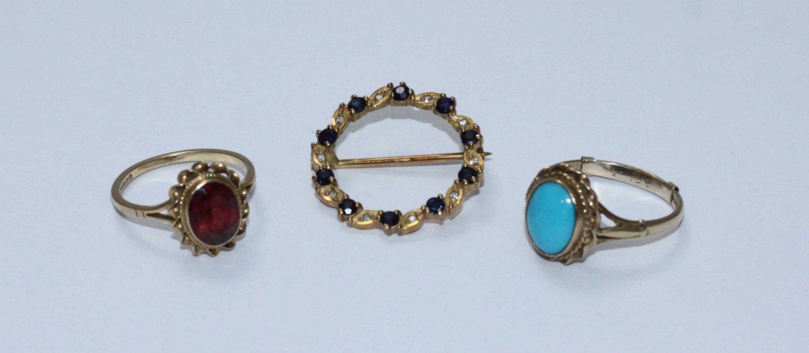 A 9ct gold ring with cabochon turquoise stone, together with a 9ct gold ring set with probably a