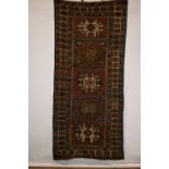 Lesghistan long rug of five-star design, north east Caucasus, dated 1301 (AH) [1885 AD] top end of