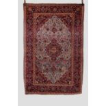 Kashan rug, west Persia, circa 1920s, 6ft. 11in. X 4ft. 8in. 2.11m. X 1.42m. Small 'nicks' to