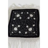 Chinese black silk shawl embroidered in ivory silk with all over paeonies and scrolling floret