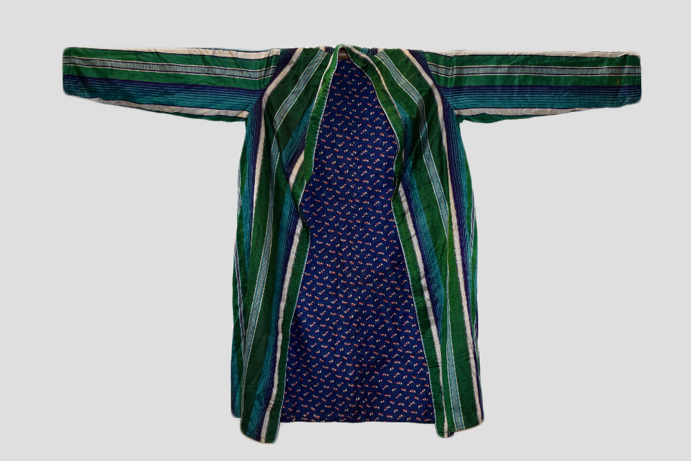 Two Uzbekistan or Afghanistan coats, 20th century, one silk satin with stripes in shades of