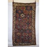 Good Kurdish long rug, north west Persia, circa 1900, 8ft. 1in. X 4ft. 7in. 2.46m. X 1.40m. The