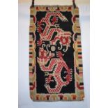 Tibetan 'dragon' rug, inner Asia, first half 20th century, 4ft. 10in. X 2ft. 8in. 1.47m. X 0.81m.