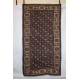 Shirvan long rug, south east Caucasus, late 19th century, 7ft. 11in. X 4ft. 4in. 2.41m. X 1.32m.