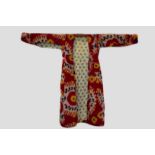 Uzbek woman's silk ikat robe with orange floss silk embroidery to waistline each side; and with