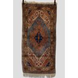 North west Persian rug, circa 1930s-40s, 5ft. 10in. X 2ft. 11in. 1.78m. X 0.89m. Lustrous wool and