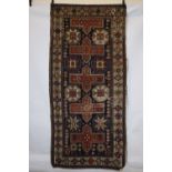 Caucasian long rug, probably Shirvan area, early 20th century, 8ft. 4in. X 4ft. 2.54m. X 1.22m.