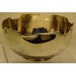 A George V silver fruit bowl, with a battlement rim, on a moulded foot, 8.5in (22cm) diameter, Maker