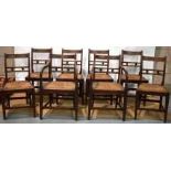 A set of eight nineteenth century country made oak dining chairs, the back rails with rondels, the