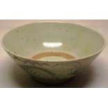 A Chinese provincial grey blue glazed pottery bowl with foliage, (possibly Ming) 9.75in (25cm) A