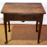A mid eighteenth century oak side table, the moulded edge top above a frieze drawer, later brass