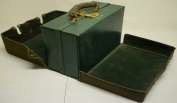 A ladies green leather travelling toiletry case, with gilt initials to the front, the salmon pink