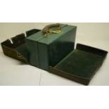 A ladies green leather travelling toiletry case, with gilt initials to the front, the salmon pink