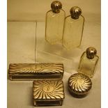 A set of six German glass toilet bottles and boxes, with .800 standard fluted silver lids,