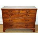 A Sheraton period mahogany veneered chest, of low proportion, the top crossbanded and inlaid