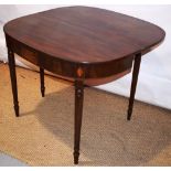 A Regency mahogany tea table, the 'D' shape fold over flap top, on a veneered frieze, with a