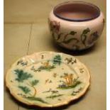 A French faience bowl, decorated coloured foliage, 10in (26cm) and a faience platter, decorated
