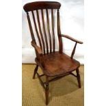 A nineteenth century beech slat back windsor armchair, with an elm crest and seat, on turned legs,