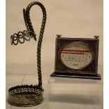 A Victorian electroplated wine bottle holder, with detachable collar to the rope twist handle,