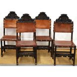 A set of four Spanish walnut side chairs, with foliage heraldic armorial, with coronets to the