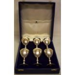 A set of six modern silver wine goblets, the tapering bowls on double knopped stems, to circular