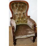 A Victorian button shaped back show frame mahogany armchair, upholstered in dralon, the padded