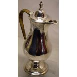 A George III North East of England silver mulled wine jug, the pear shape body engraved an