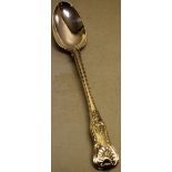 A William IV silver basting spoon, Kings pattern, engraved a dove crest within a garter motto,