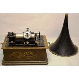 An Edison standard phonograph, with tole trumpet and iron winder, in an oak case, 13in (33cm) and