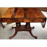 A George IV rosewood sofa table, the drop leaf top above two frieze drawers in front and two dummy