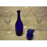 Three large wine glasses, with trumpet shape bowls, (one with small crack) on teardrop stems to a