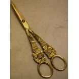 A pair of Regency silver gilt grape shears, the cast handles of basket work grape hods, with ring