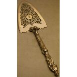 An unusual William IV silver fish trowel, the pierced fretwork and engraved blade, with a leopards