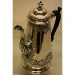 A George II Scottish silver coffee pot, the tapering body and hinged moulded lid, with borders of