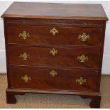 A small mahogany veneered chest, fitted a baize writing slide, above 3 long graduated drawers,