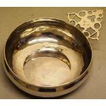 A William and Mary silver porringer or bleeding bowl, with initials to the pierced fretwork