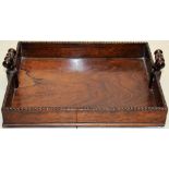 A William IV rosewood book carrier, the gallery with an egg and dart border, two turned side