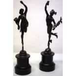 A pair of nineteenth century bronze figures of Mercury and Fortuna, standing on slate circular