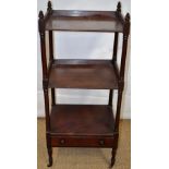 An early nineteenth century mahogany whatnot, the top two tiers with chamfered galleries, having