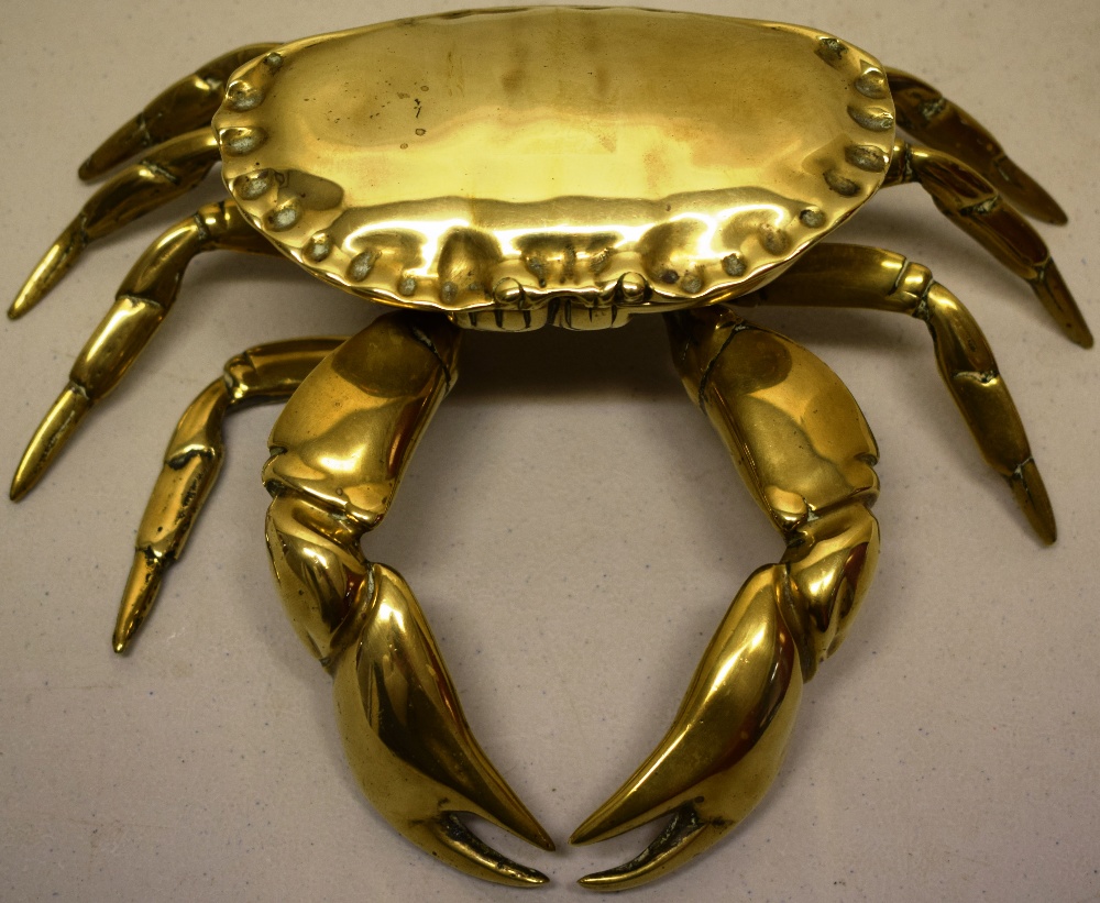 A late nineteenth century novelty brass inkstand of a crab, the hinged shell reveals an inkwell, 9in