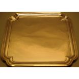 A modern silver square salver, the raised border with cusp corners on concave panel feet, a