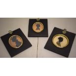 A pair of Victorian oval silhouette portraits of a mother and a child, together with another of a