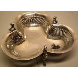 A late Victorian silver trefoil dessert dish with pierced fretwork sides, on cast scroll panthers