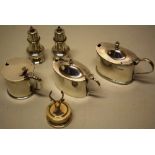 A Victorian oval silver mustard pot, another late Victorian mustard pot and a circular mustard