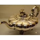 An early Victorian silver melon panelled teapot, with a swan neck spout, the hinged cover with a