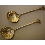 A pair of George II silver onslow pattern sauce ladles, with shell fluted bowls, marks indistinct,